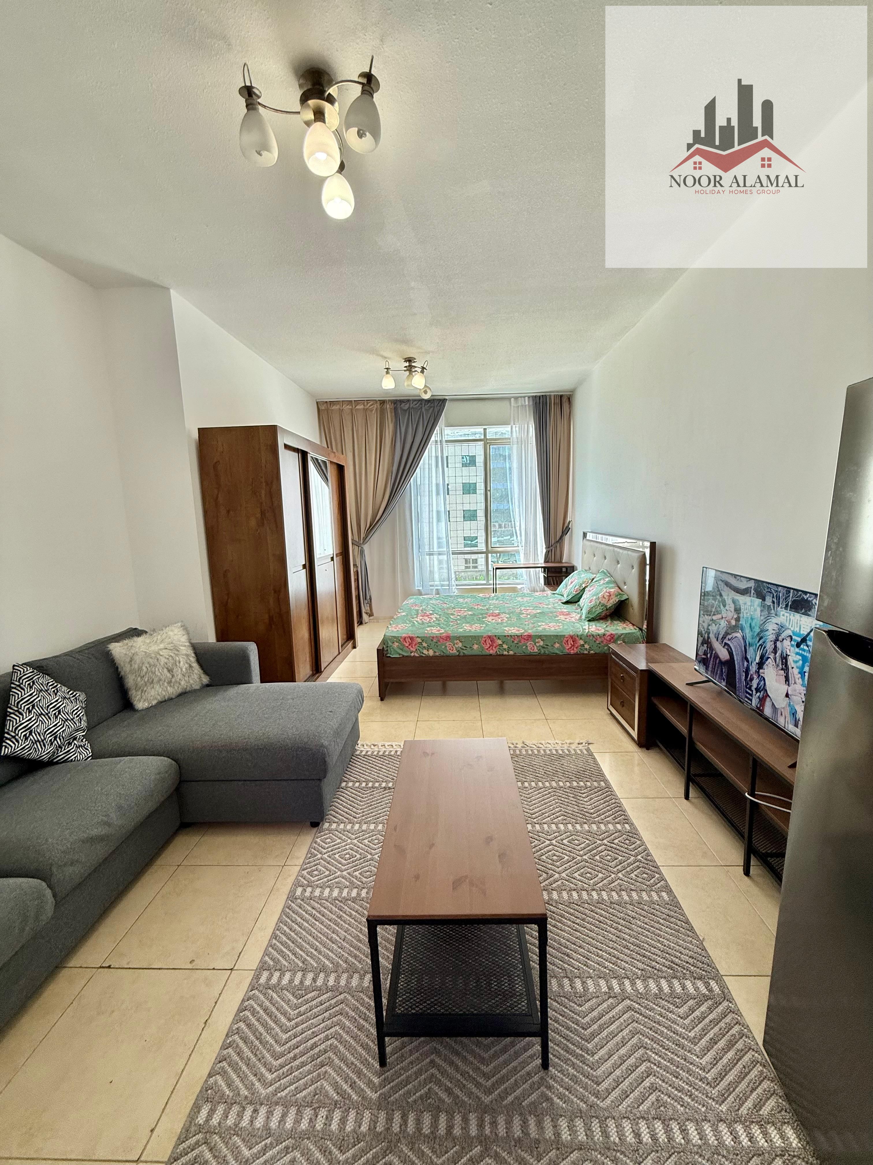 Sharjah, Al Khan, furnished studio apartment with hotel-style furnishings, second occupancy, spacious room, separate kitchen, bathroom, large window,