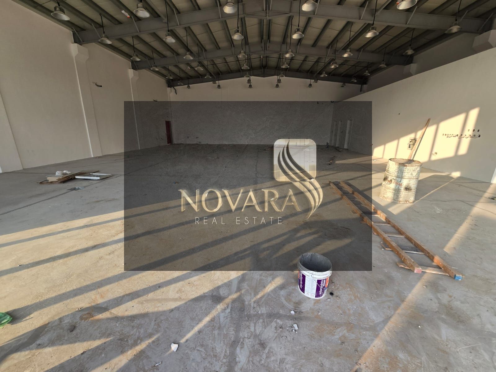 A showroom is available for rent in Al Jurf 3 with an area of 5500 square feet, located on a main street.