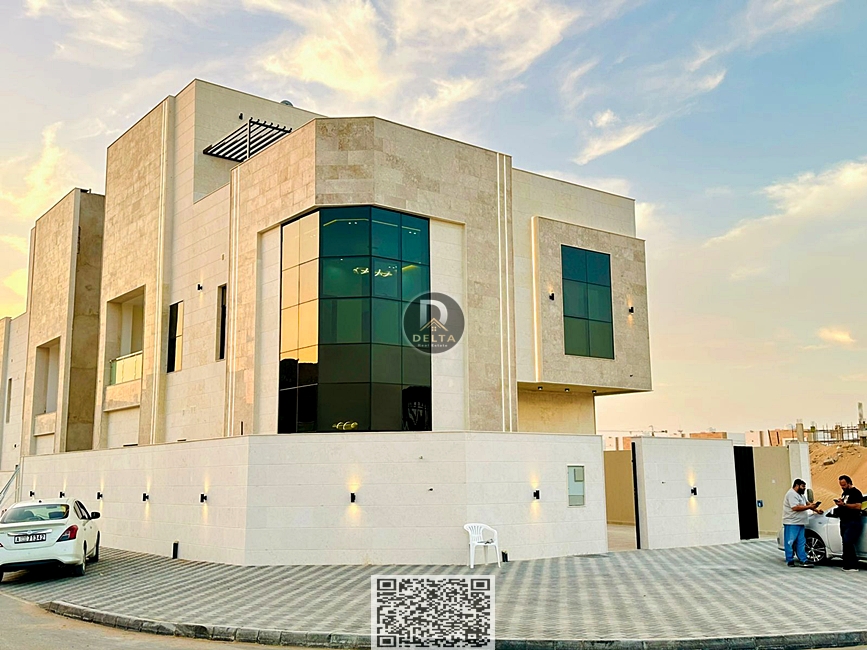 For sale, including registration and ownership fees, a corner villa on two streets in Al Helio 2 area - near the mosque and Sheikh Mohammed Bin Zayed