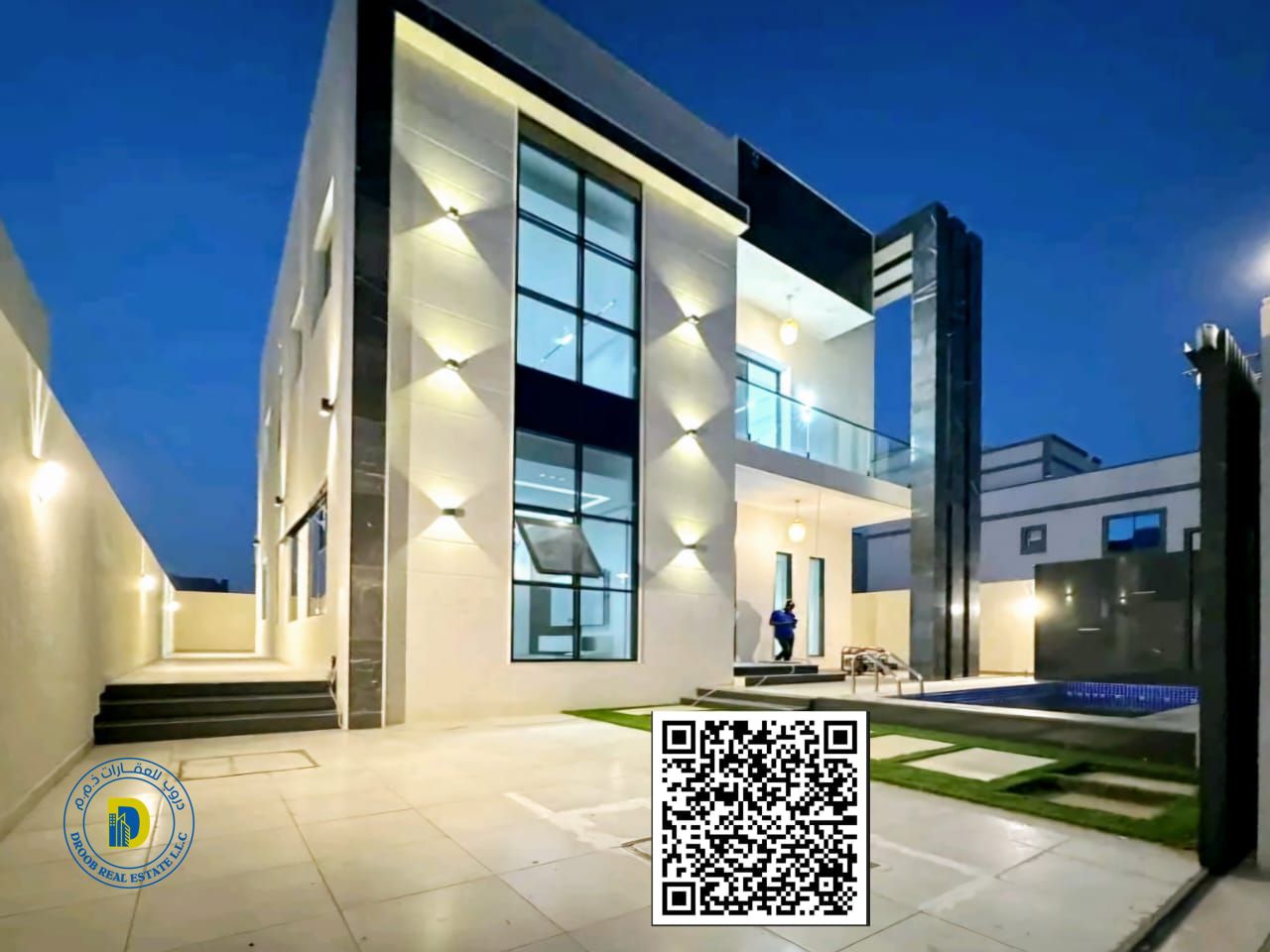 Modern villa with a large swimming pool for sale in Al Bahia area. Price includes registration fees.