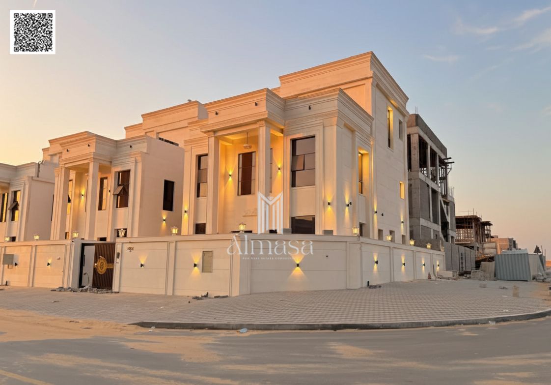 Classic corner villa on two streets, in Al Helio 2, Ajman, two floors and a roof, 6 rooms, at a very attractive price, freehold ownership for all nati