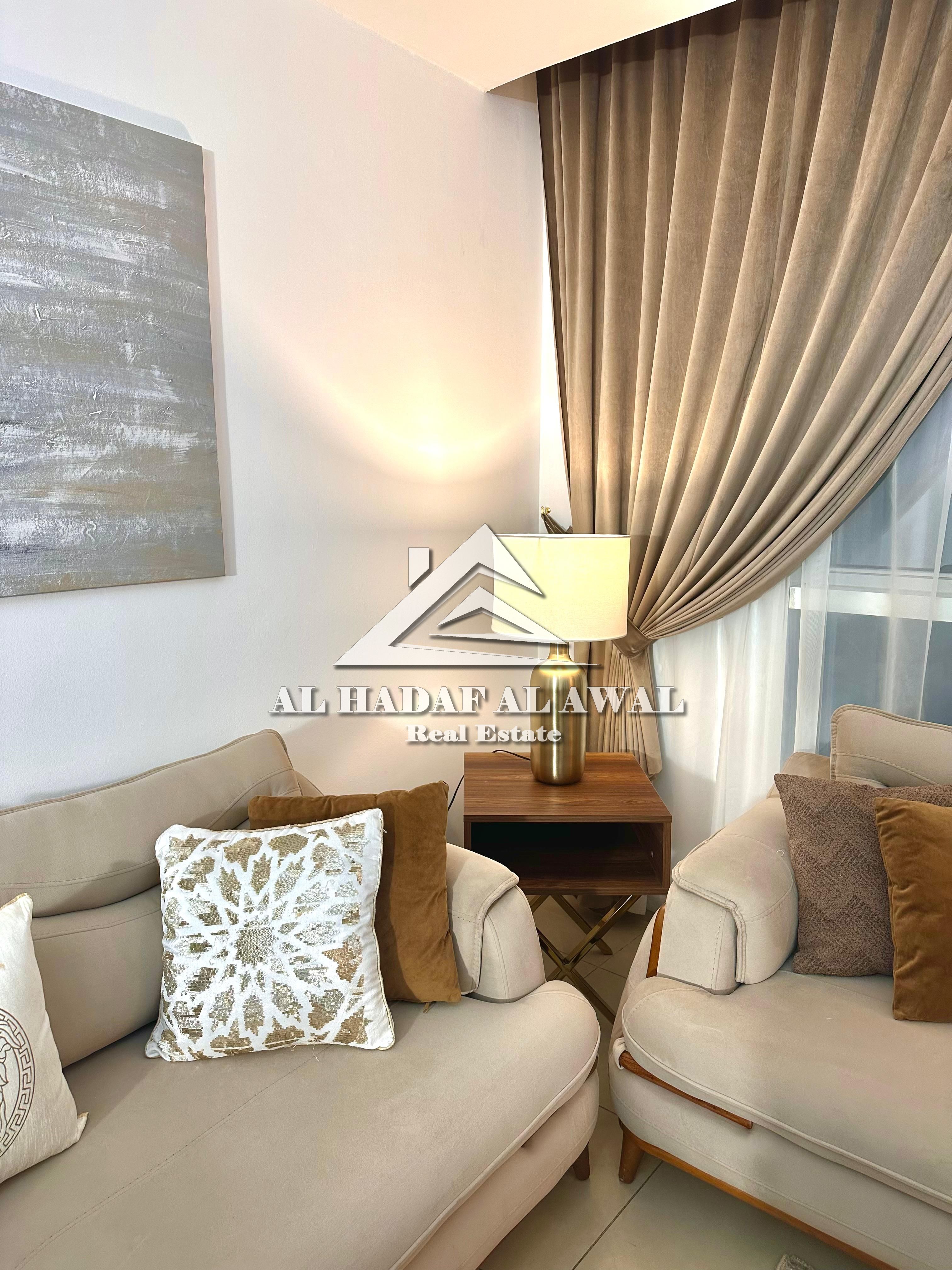 Al Qasba Beach2 Tower: One bedroom and living room with two bathrooms and a balcony with a sea view. The apartment is spacious. Rent 6700