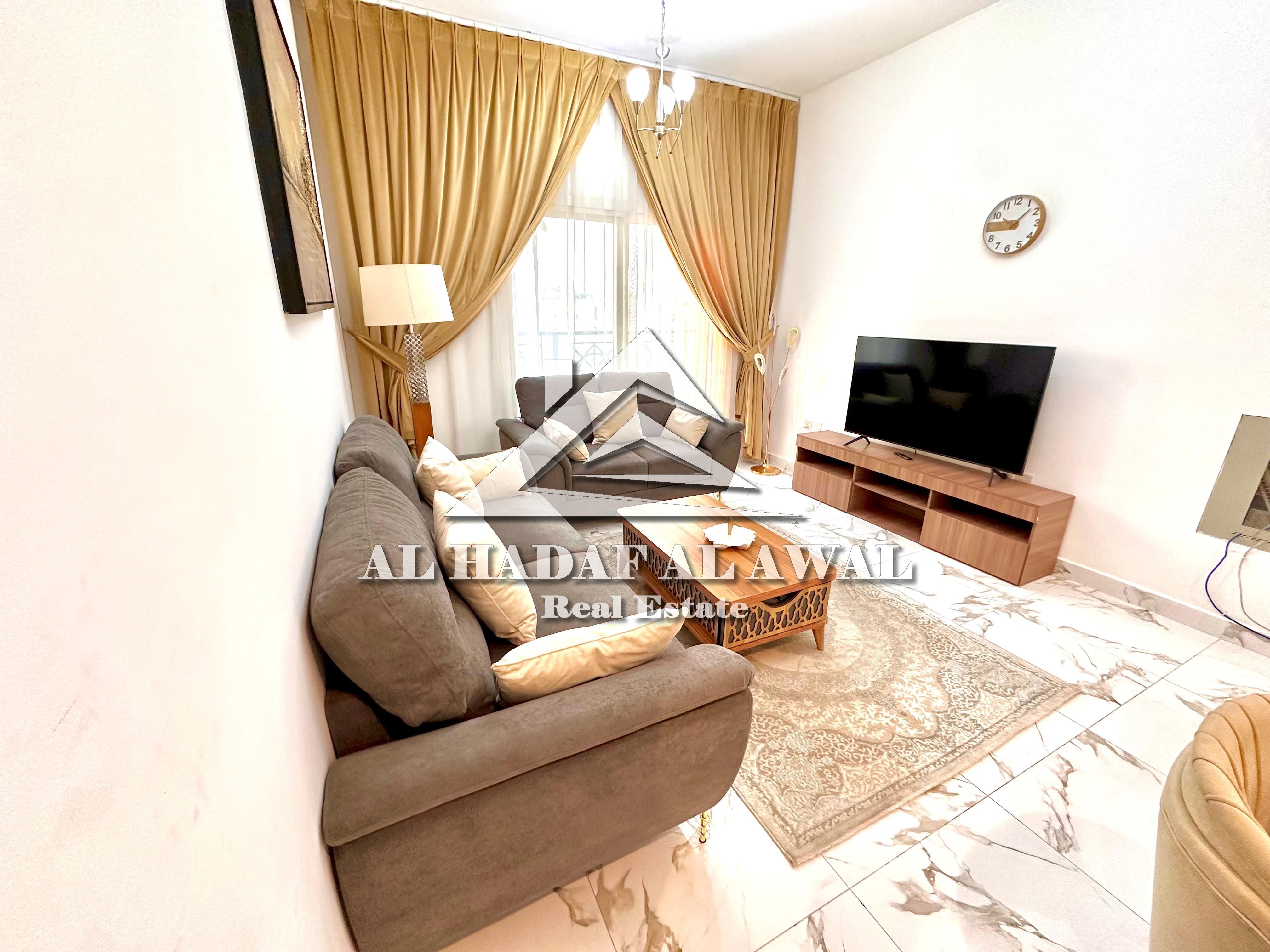 Sharjah, Muwaileh Commercial, next to Al Zahia City Centre A one-bedroom apartment with a living room, two bathrooms, and a balcony is available