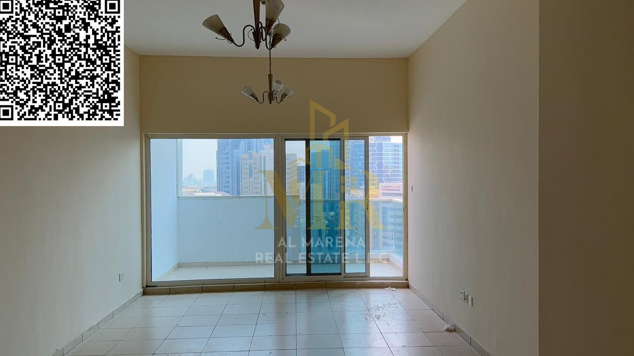 For sale: A distinctive apartment in One Towers – Ajman | Two master bedrooms + spacious living room + kitchen + three bathrooms + city and garden