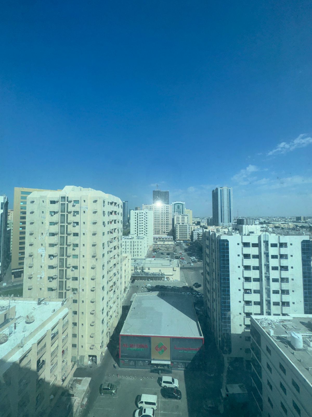 For annual rent in Sharjah, specifically in Al Majaz 2 area: a one-bedroom apartment with a living room, bathroom, and air conditioning (provided by t