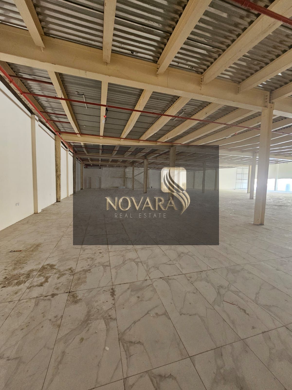 or Rent: Large Commercial Showroom in Al Jurf Industrial 3 – Main Road Frontage