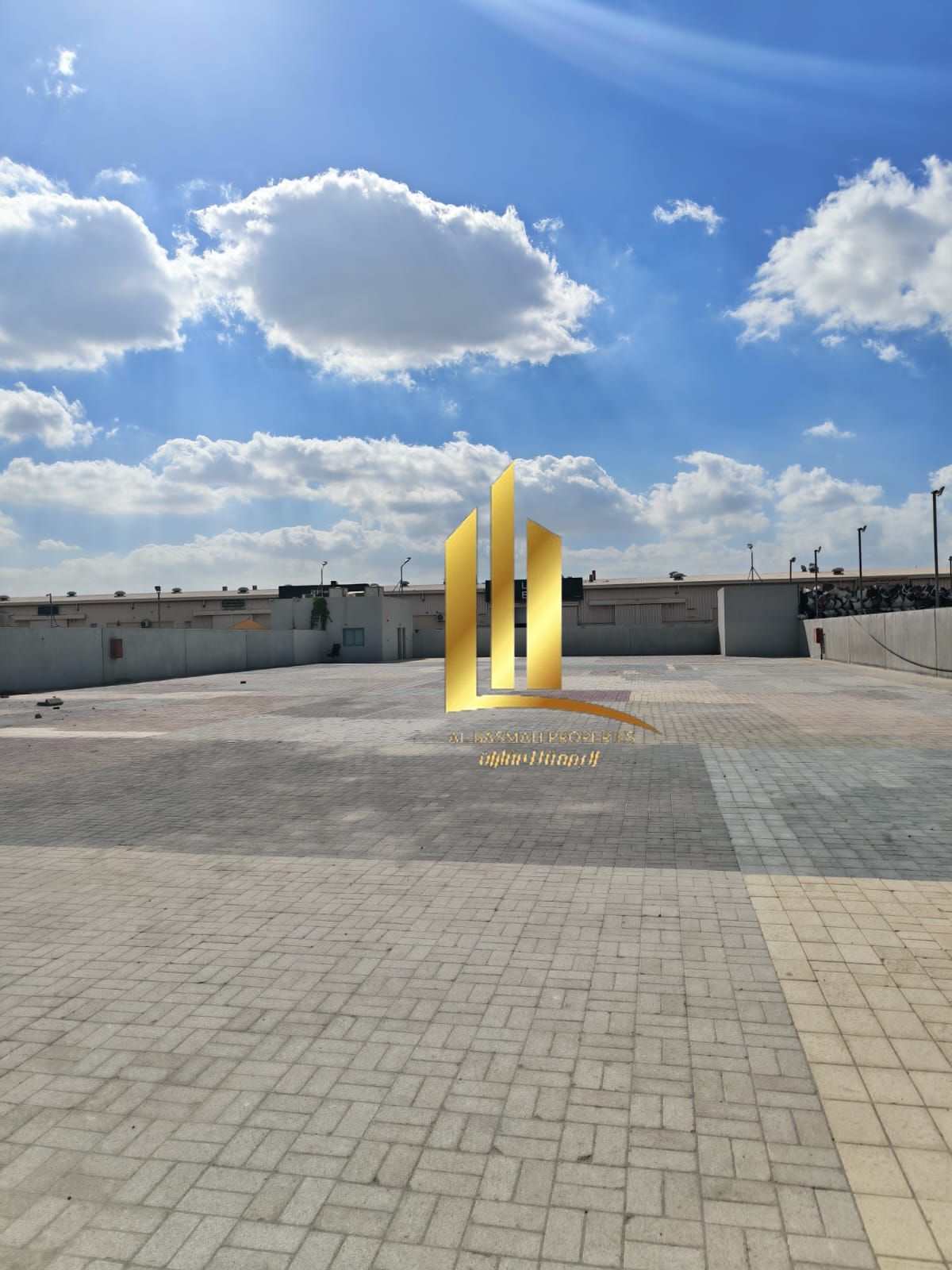A fenced land of 20,000 square feet for rent in Al Sajaa directly on the main road.
