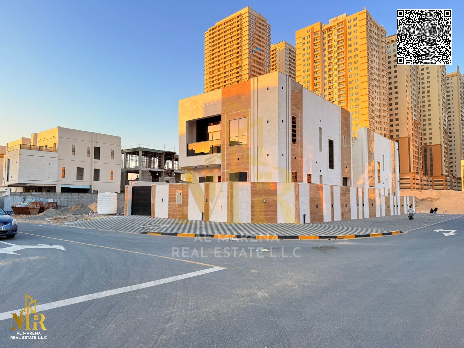 Corner villa behind Mohammed Bin Zayed Rd, 2 floors, 5 master bedrooms, price includes all fees, prime location, ideal for living or investment.