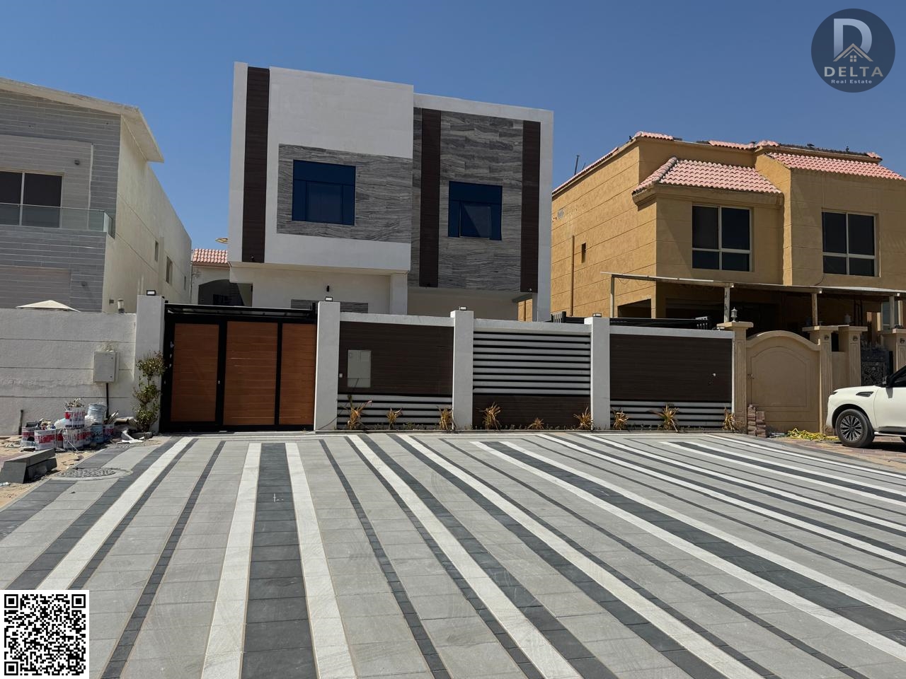 A modern villa in Al Muwaihat 1, one of the closest areas to all social services. The villa features an internal garden on a main street with a large