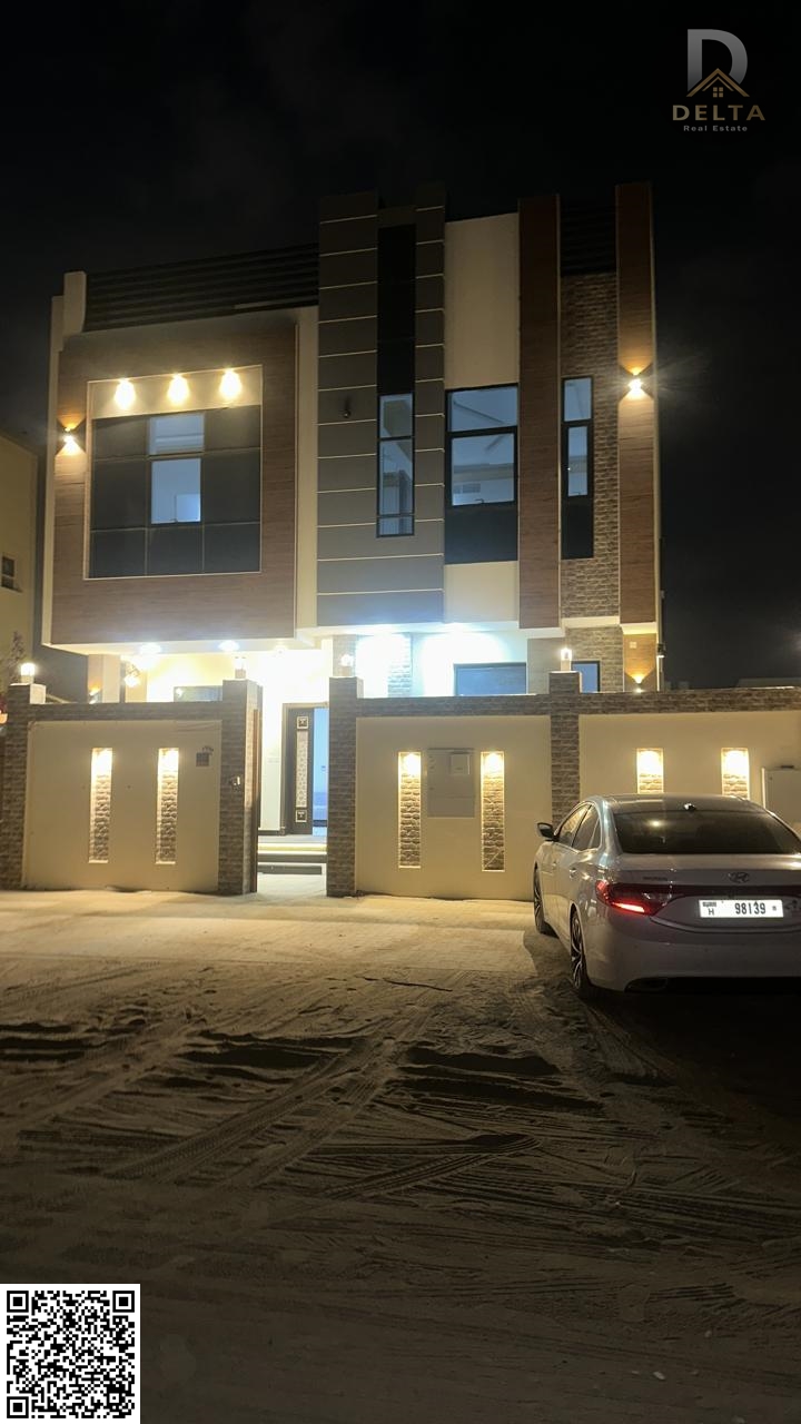 Own a luxurious villa in Ajman, Al Helio 2 area, with modern designs and spacious areas, located on the main street. It consists of three floors: grou