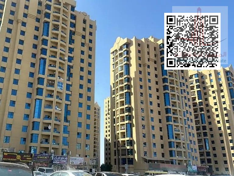 Two bedrooms and a living room in Al Khor Towers for sale, with two bathrooms and a maid's room, at a bargain price.