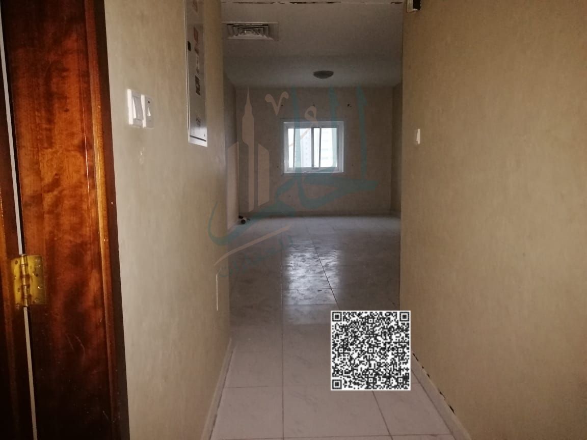 For annual rent, two rooms, a hall, two bathrooms, a kitchen, and two balconies, Al Rashidiya 3 area, behind Ajman One Towers and close to Ajman Corni