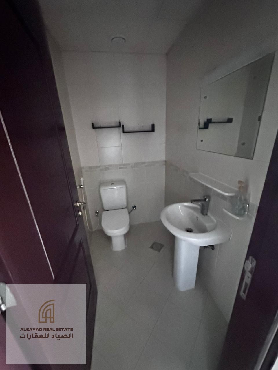 Apartment for rent in the Al Qasba area, with two bedrooms, a living room, built-in closets, a laundry room, and a storage room. Payments can be ma