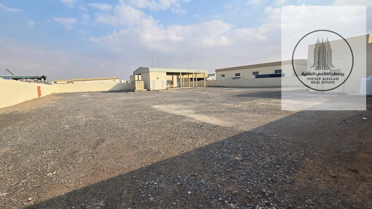 A prime industrial yard for rent in Umm Al Quwain – spacious area with a canopy, offices, and ready-to-use services.