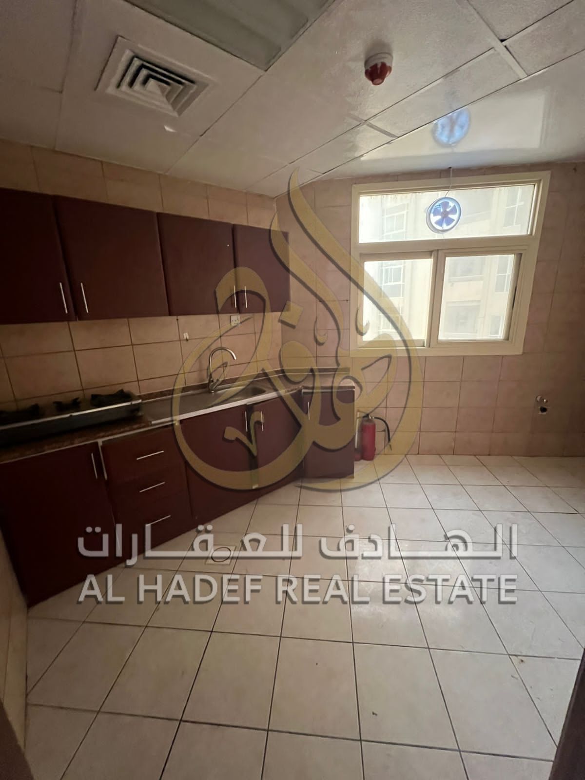 A room and hall apartment is available for annual rent in Al Qasimia Al-Nad with a large balcony, 1 bathroom, a big kitchen, spacious area, payable in