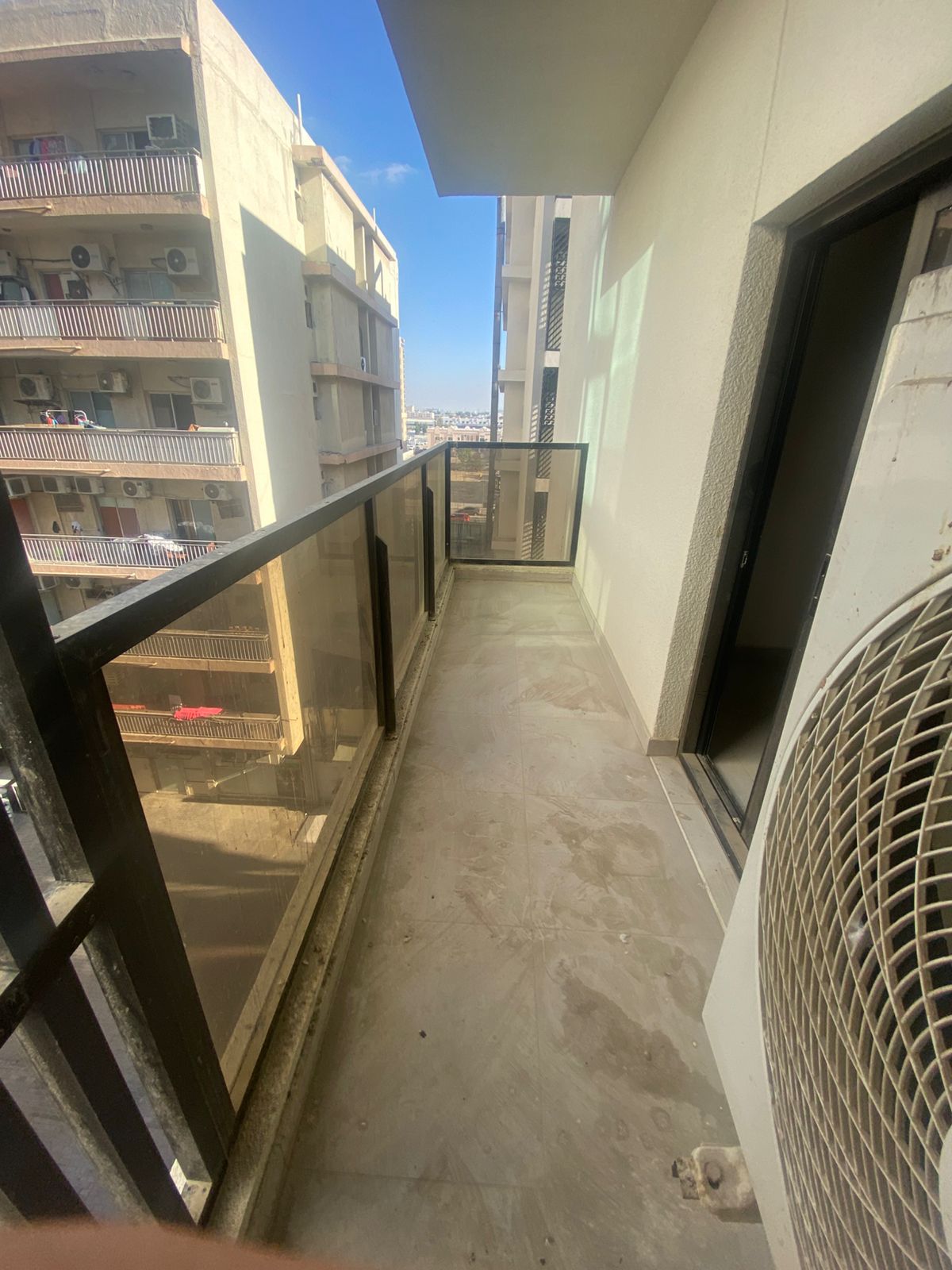 For annual rent in Sharjah, specifically in Al Majaz 2 area: a one-bedroom apartment with a living room, bathroom, and balcony, offering excellent spa