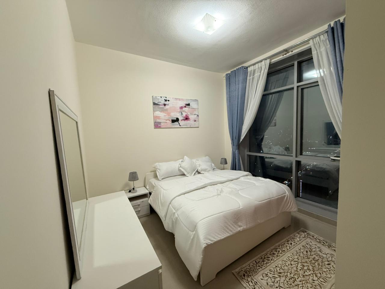 Furnished 2-bedroom apartment with a living room for monthly rent on Ajman Corniche