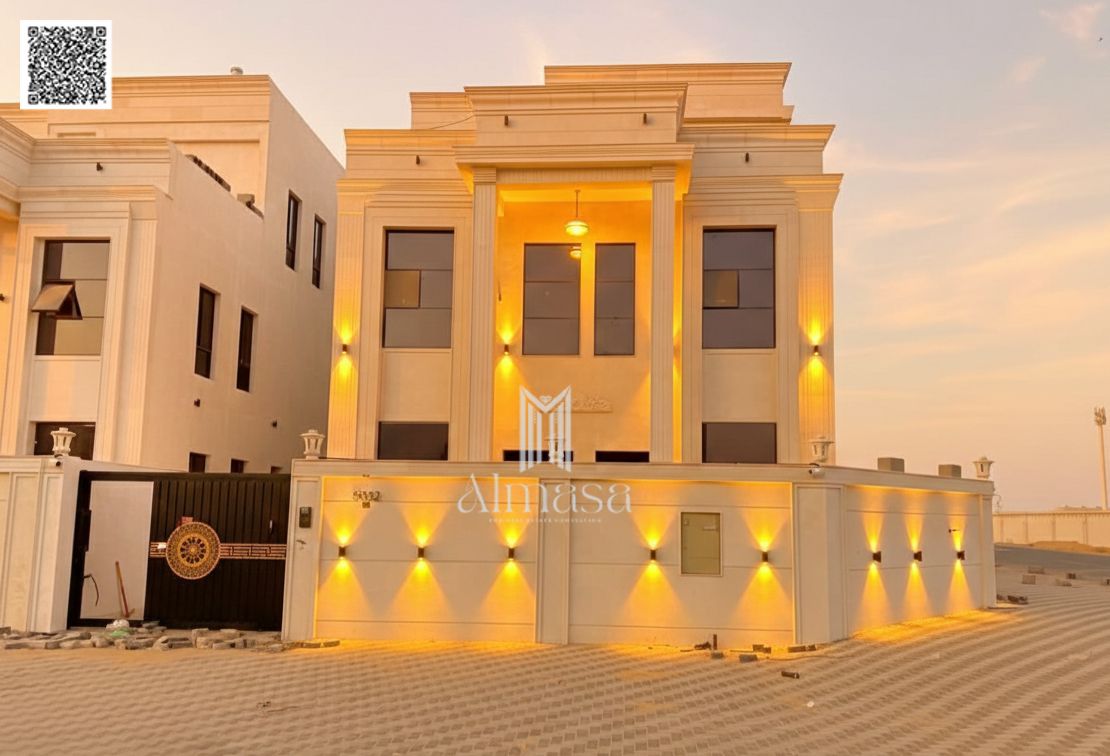 Classic corner villa on two streets, in Al Helio 2, Ajman, two floors and a roof, 6 rooms, at a very attractive price, freehold ownership for all nati