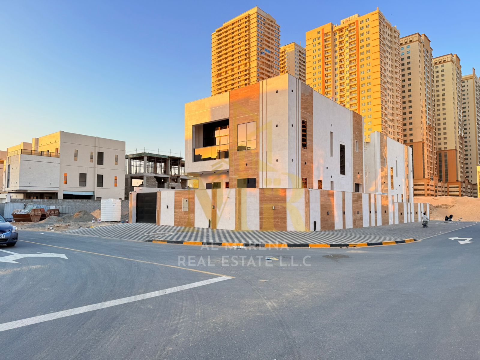 Corner villa on the corner of two streets, in a prime location near Emirates Bypass Road, featuring 4 master bedrooms.