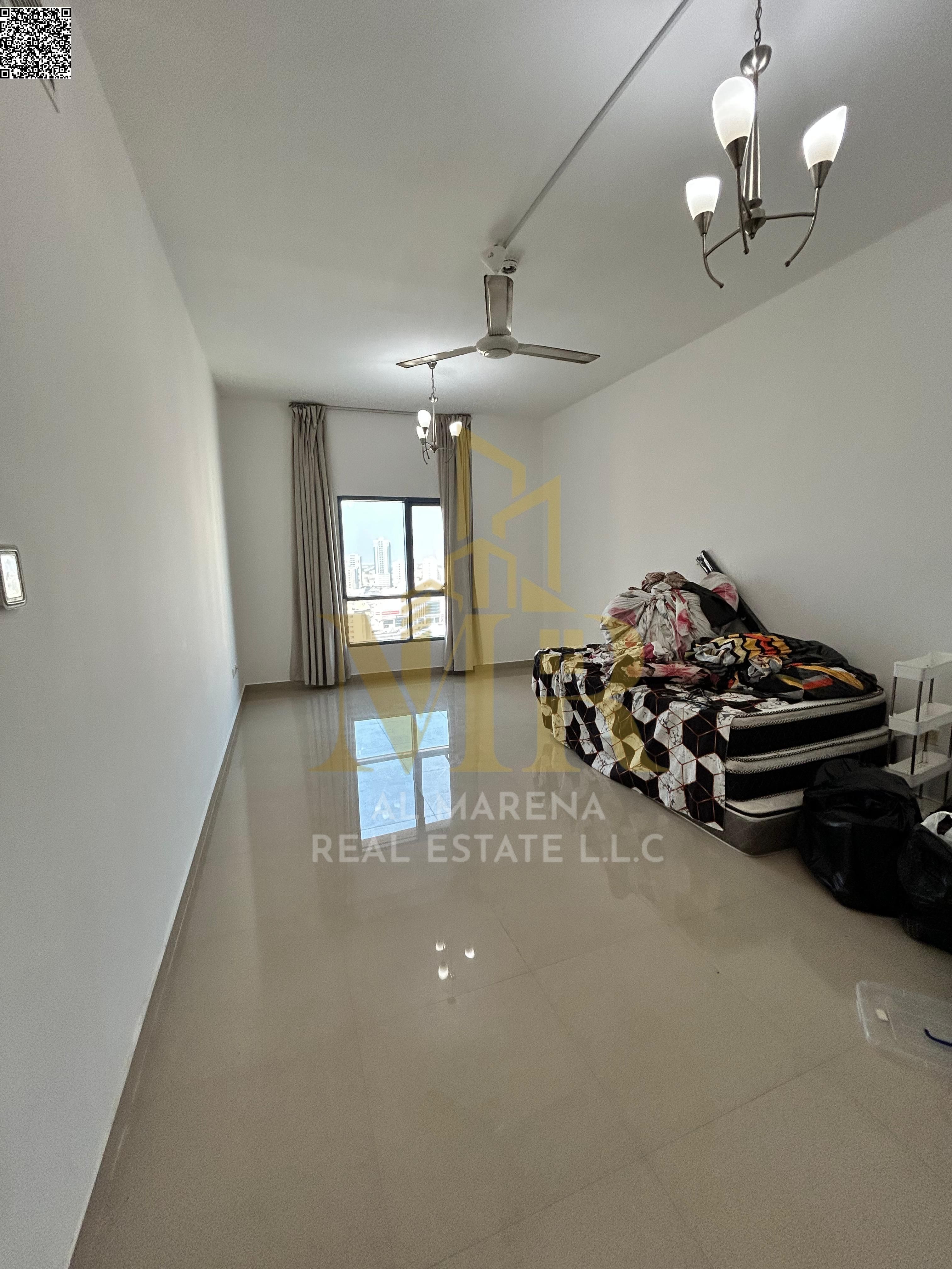 Luxury ready-to-move-in studio for sale in Al Naeema Tower C, open view of Al Hikma School & Black Ramada, 565 sq ft, private parking, 5-year installm