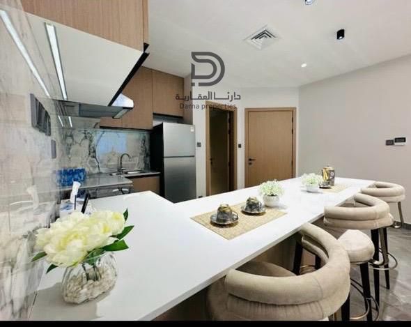 Al Khour Towers, two-bedroom apartment with a living room for sale, direct view of the creek