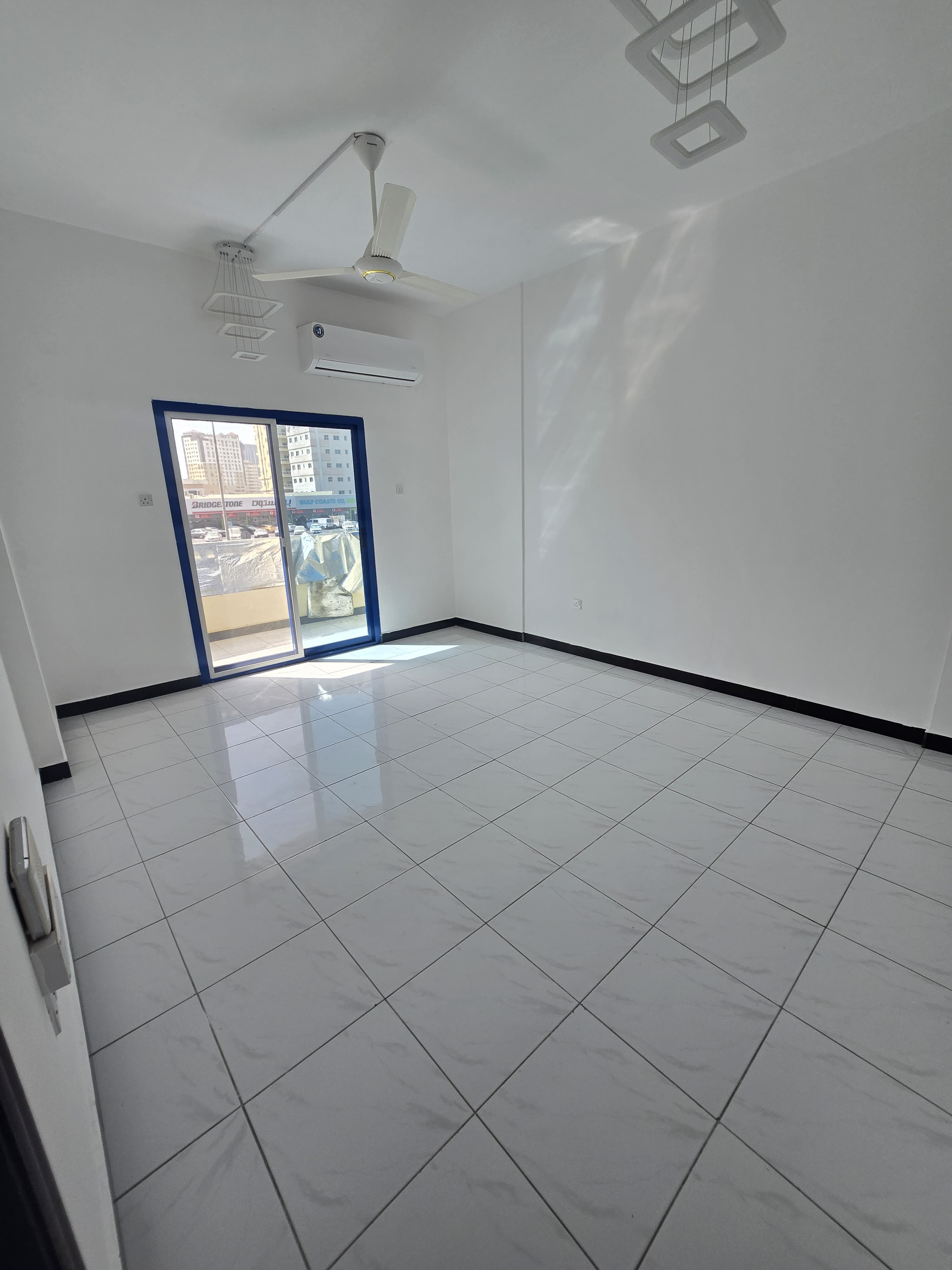 A separate room and living room, two bathrooms, and a balcony in Al Nuaimiya 1, on Al Ittihad Street, next to Emirates Markets, with an open view of t
