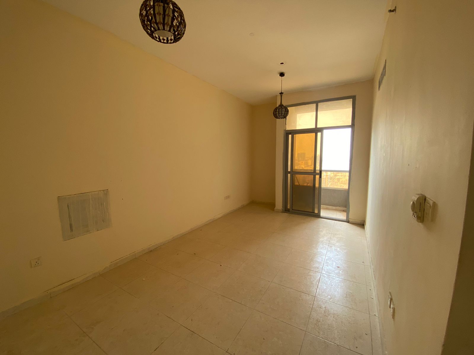 A separate room and living room, two bathrooms, and a balcony in Al Nuaimiya 1, near Al Hikma School, with an open view of the main street.