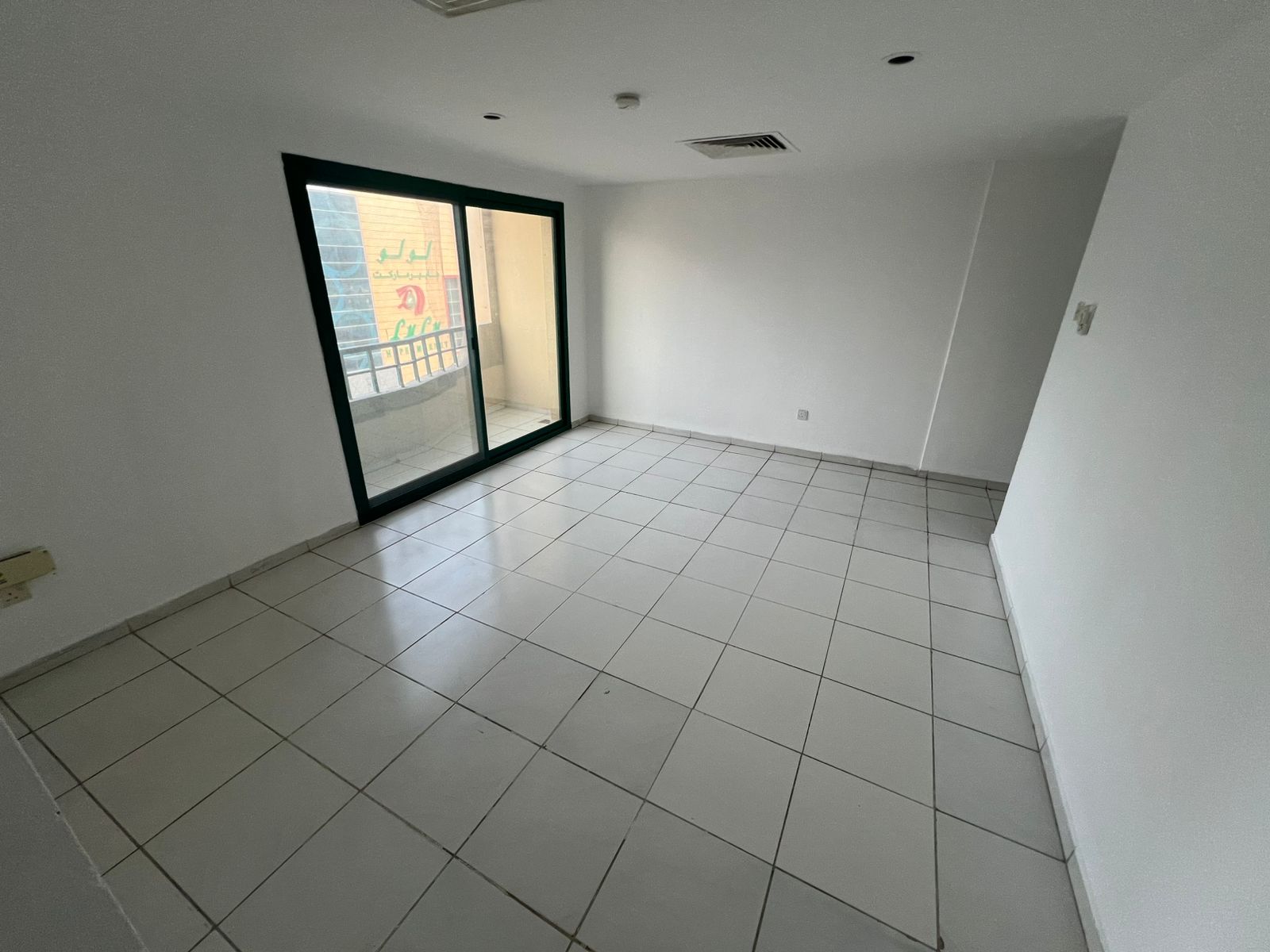 Two-bedroom apartment with balcony in Sharjah Al Butina, spacious and family-friendly, near shops.