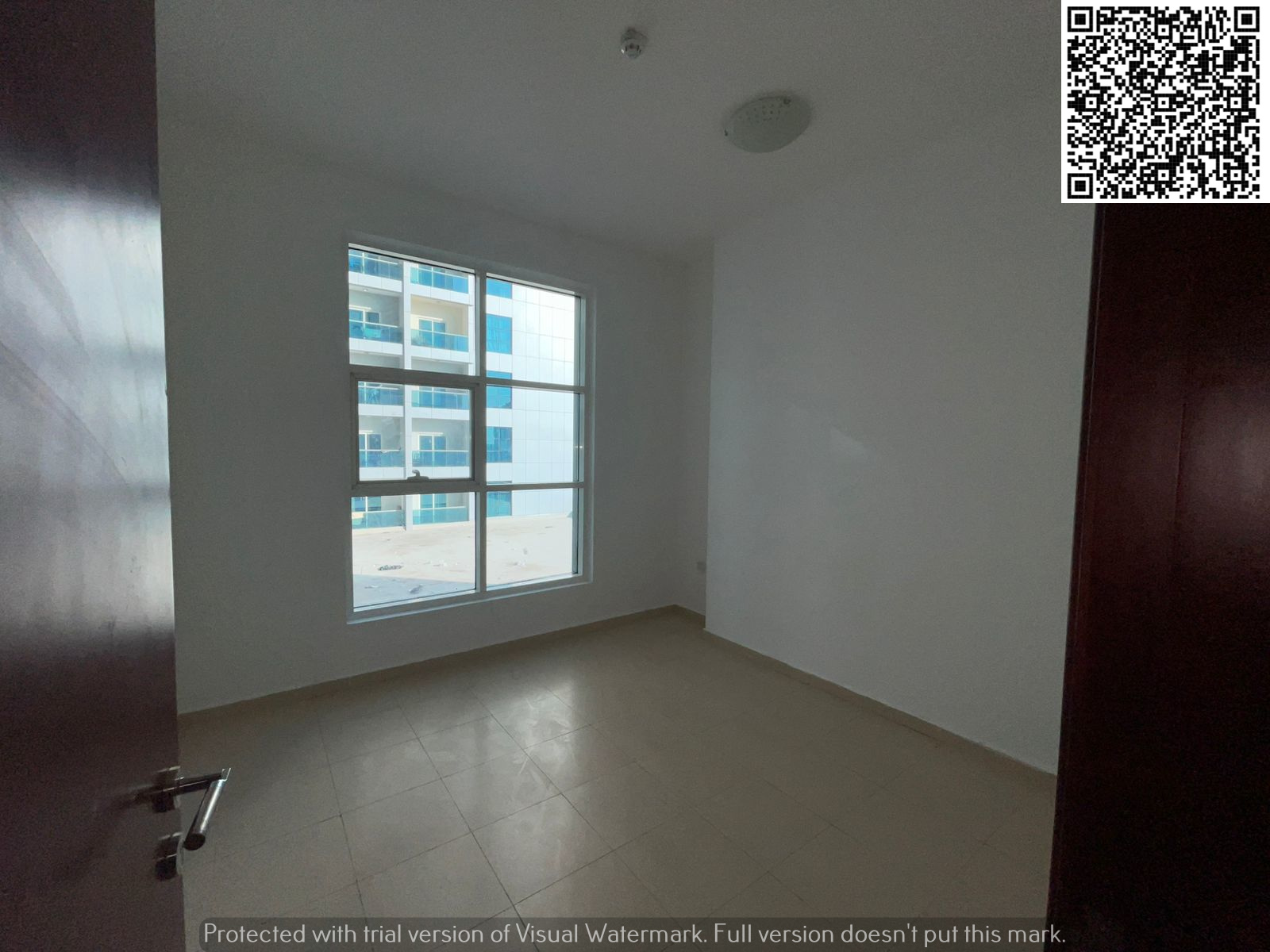 2BR apartment for sale in City Towers Ajman, 1,158 sq. ft, with parking, vacant and ready to move in, easy installment plan.