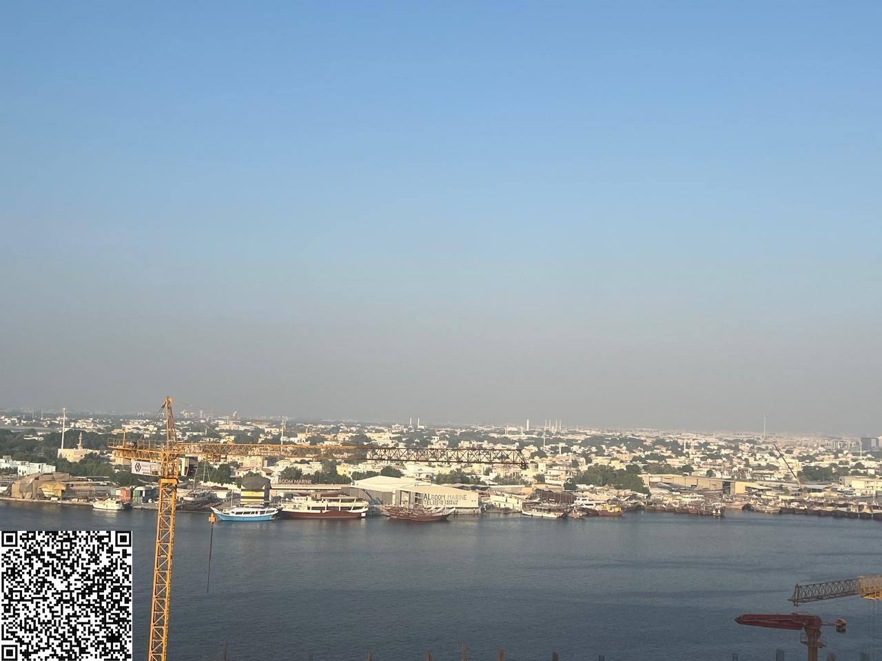 Two bedrooms and a living room in Al Waha, overlooking the creek, for 700,000 (furnished).