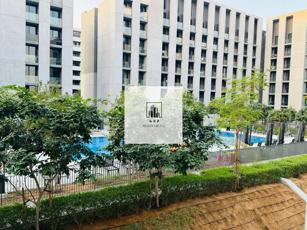 Spacious luxurious studio apartment with kitchen appliances and balcony pool view