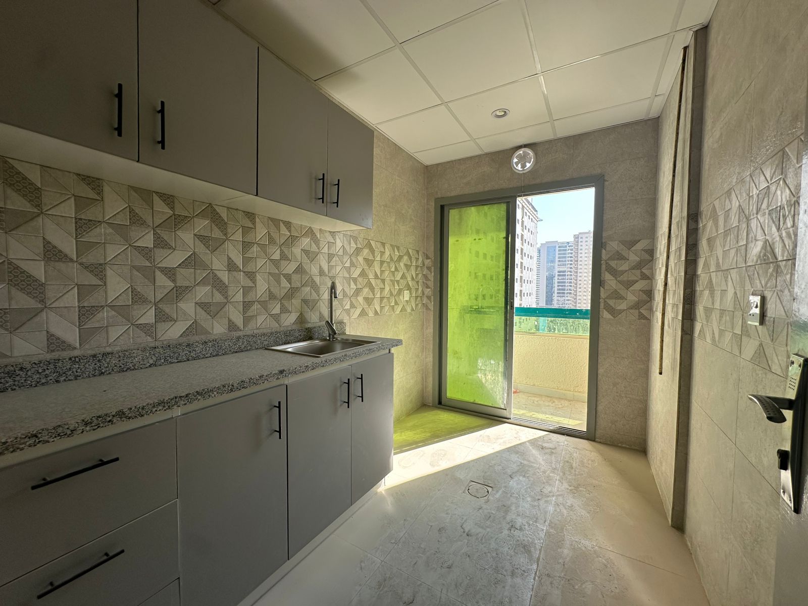 Small layout one-bedroom apartment with balcony, strategic location, first tenant after renovation, split AC, close to Dubai exit. Rent AED 35,000.