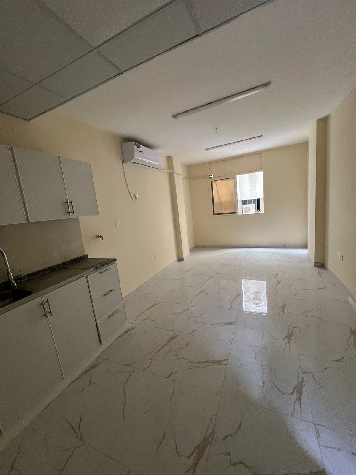 First studio apartment after renovation in Al Rolla, large area, ready to move in with flexible payment facilities, 17,000 dirhams.