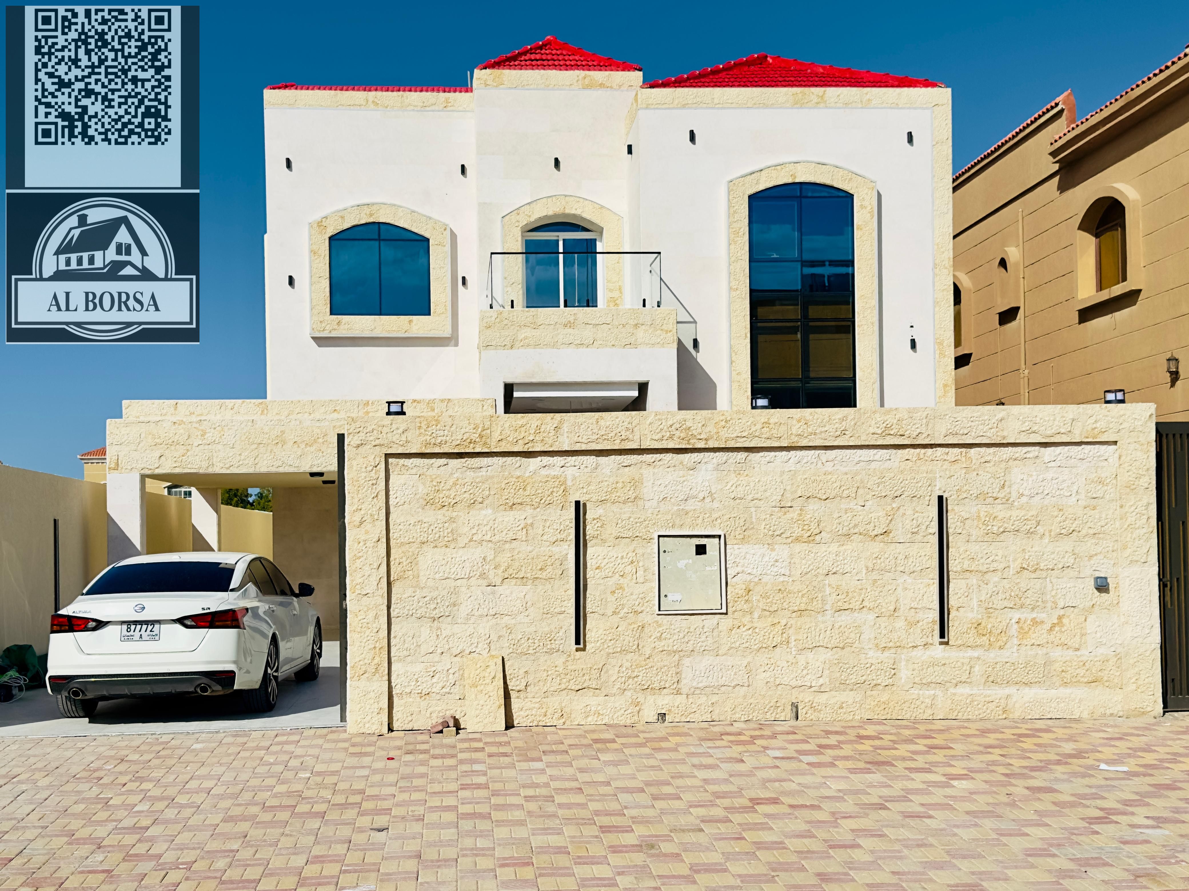 Villa for sale in Al Muwaihat 1, behind Nesto | Land area 5000 ft² | Built-up area 4300 ft² | 5 master bedrooms | Includes electricity, water, and