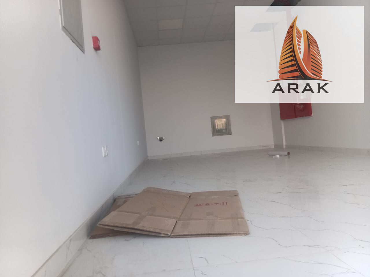 Commercial shop available for annual rent in Al Jurf 3, located in a lively area suitable for various commercial and service activities. The shop has