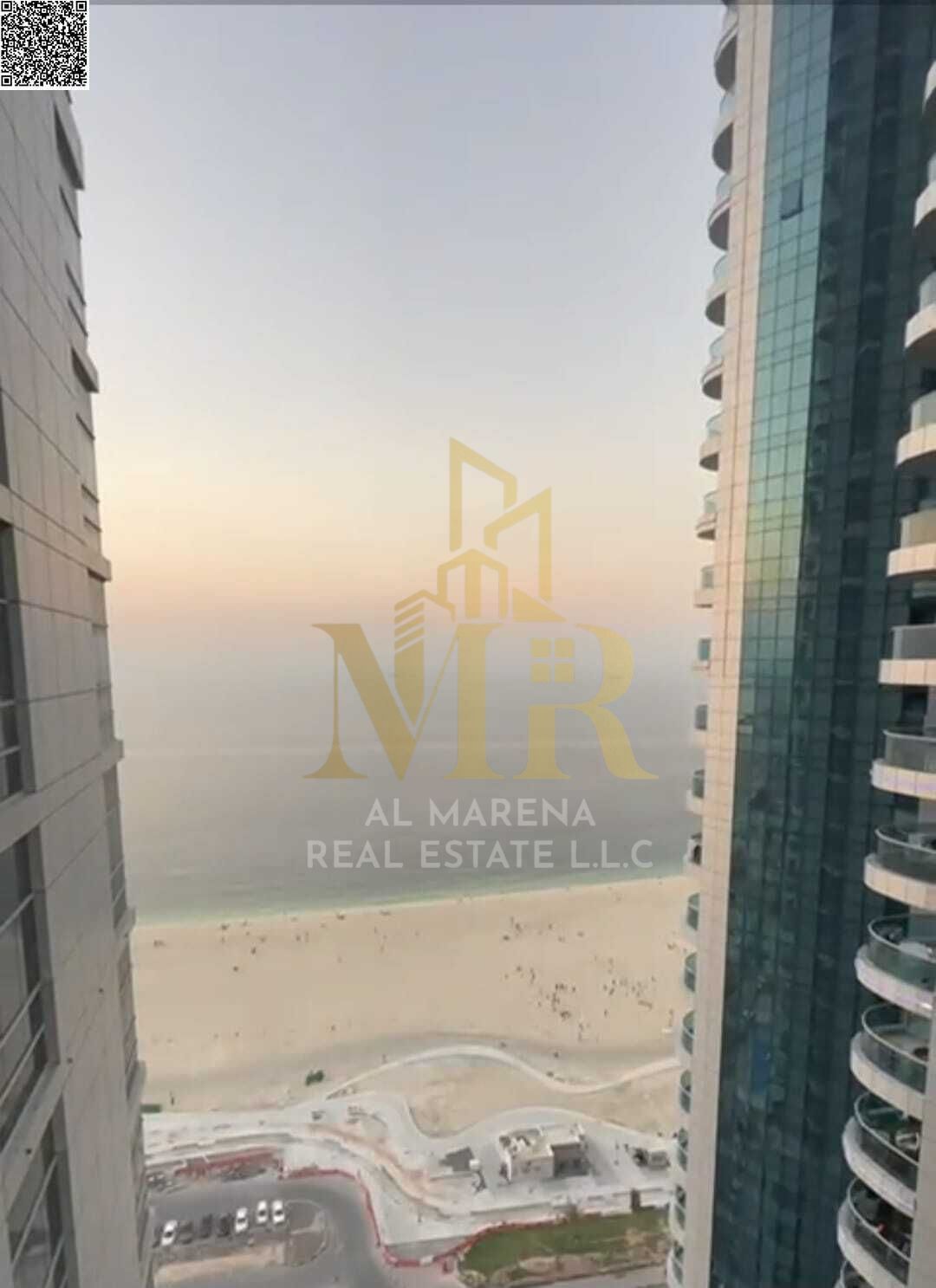 For sale: A luxurious two-bedroom apartment with partial views of Ajman Corniche, in a prestigious location near the sea, featuring an elegant design