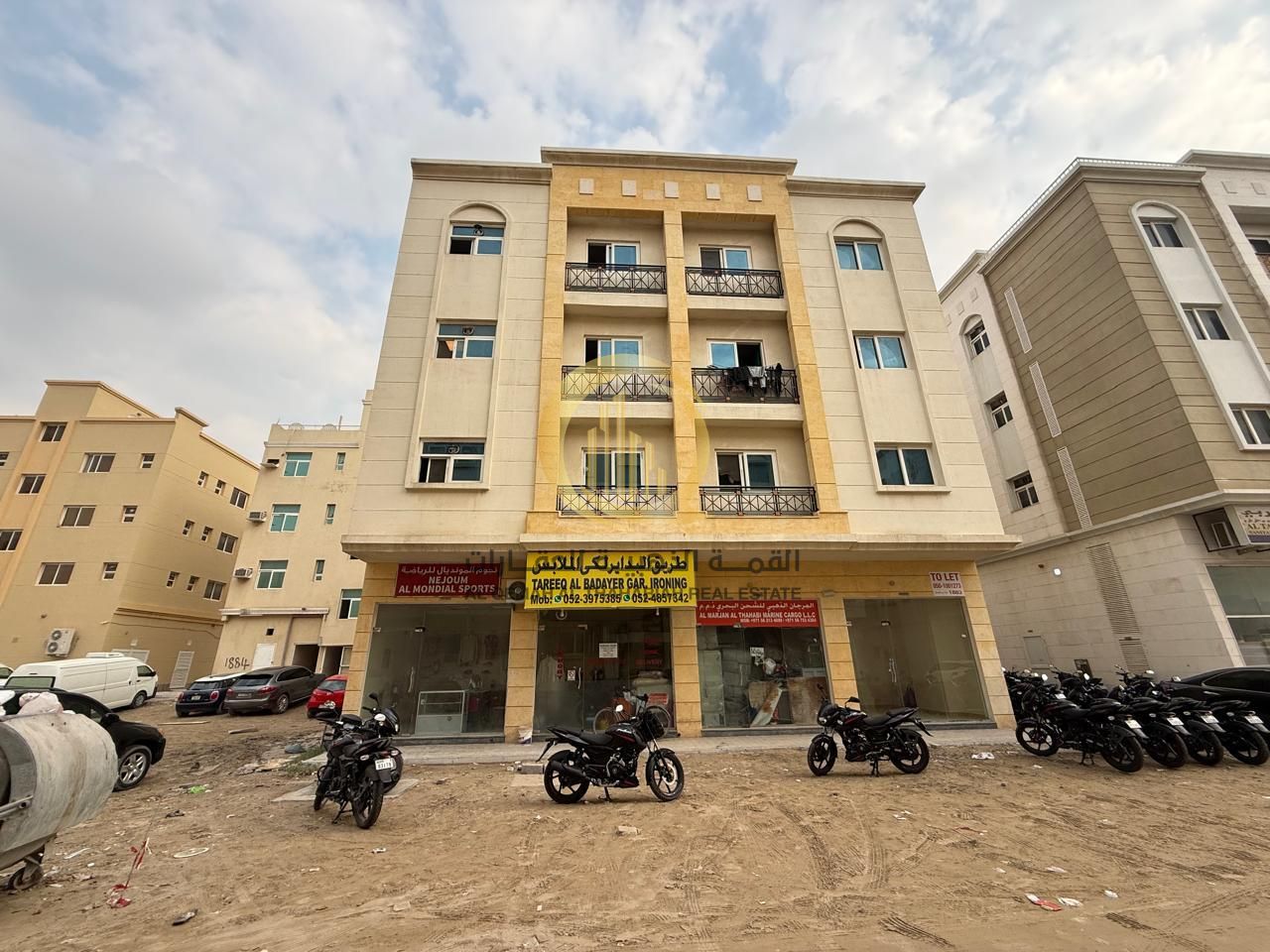 For sale: a ground floor and three-story building in Sharjah, commercial, Muwaileh area. Area: 2,906 sq ft on an 18-meter street.