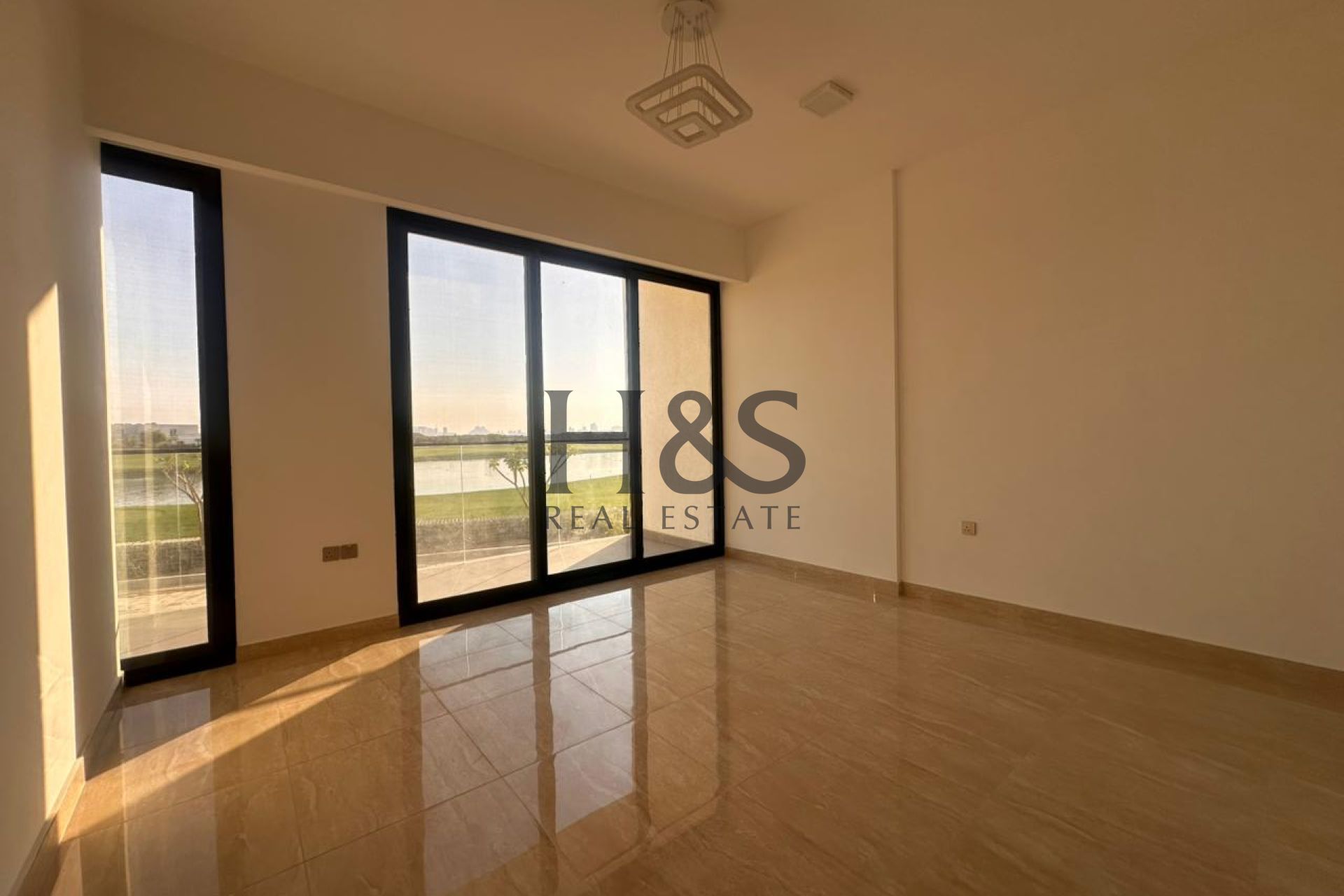 Sunlit Studio Apartment | Open Kitchen with Golf Views
