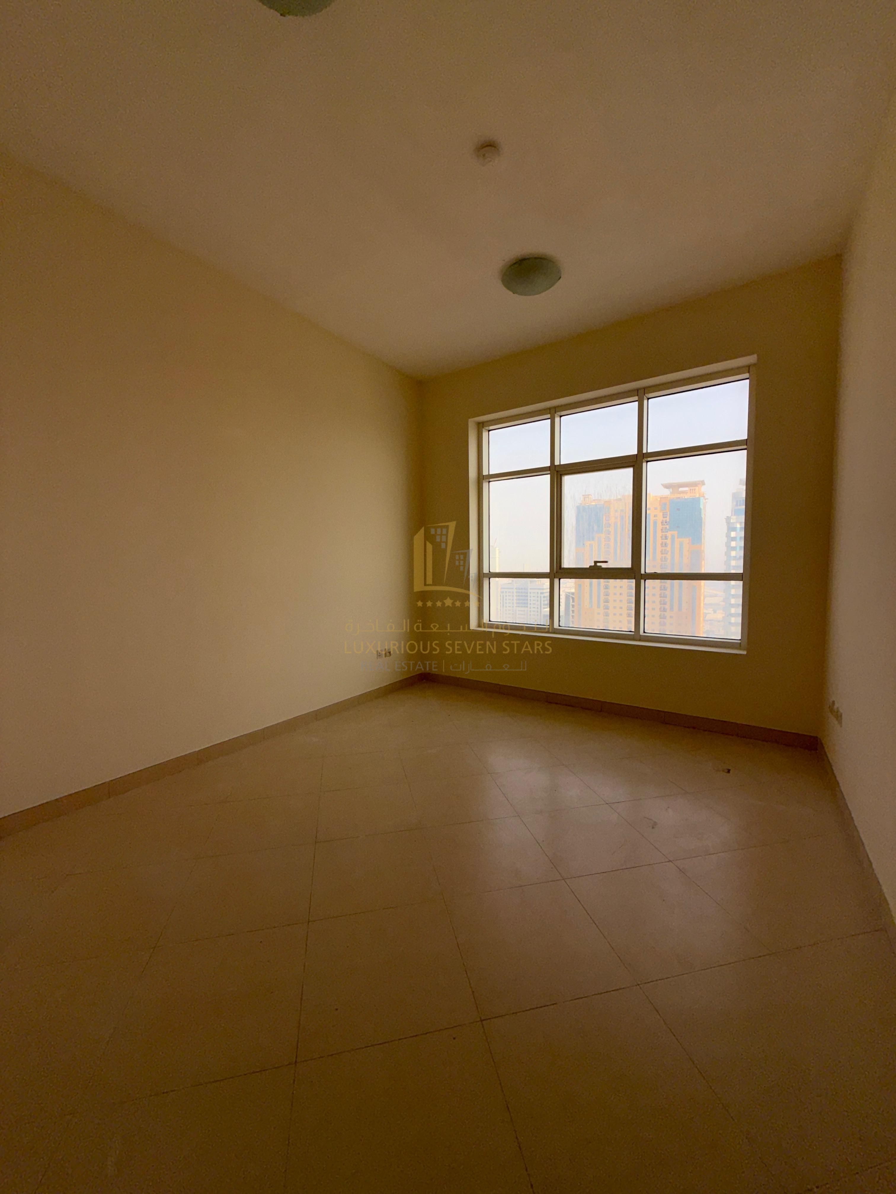 A three-bedroom apartment with a living room for sale, with a rear view