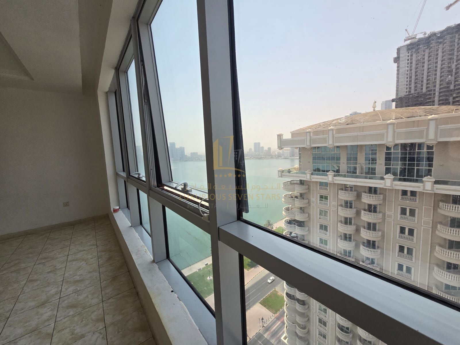 For Sale 2-Bedroom Apartment in Al Dana Tower – Al Majaz 3, Overlooking Khalid Lake