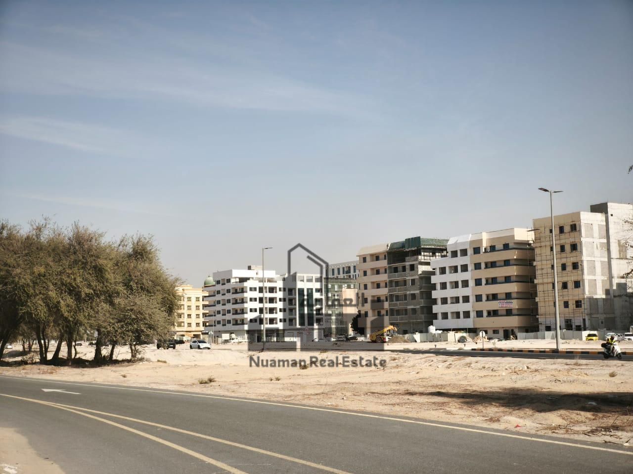 Corner plot for sale with area of 10,000 sq. ft, strategically located on two main roads (30m & 24m), offering dual frontage and strong investme