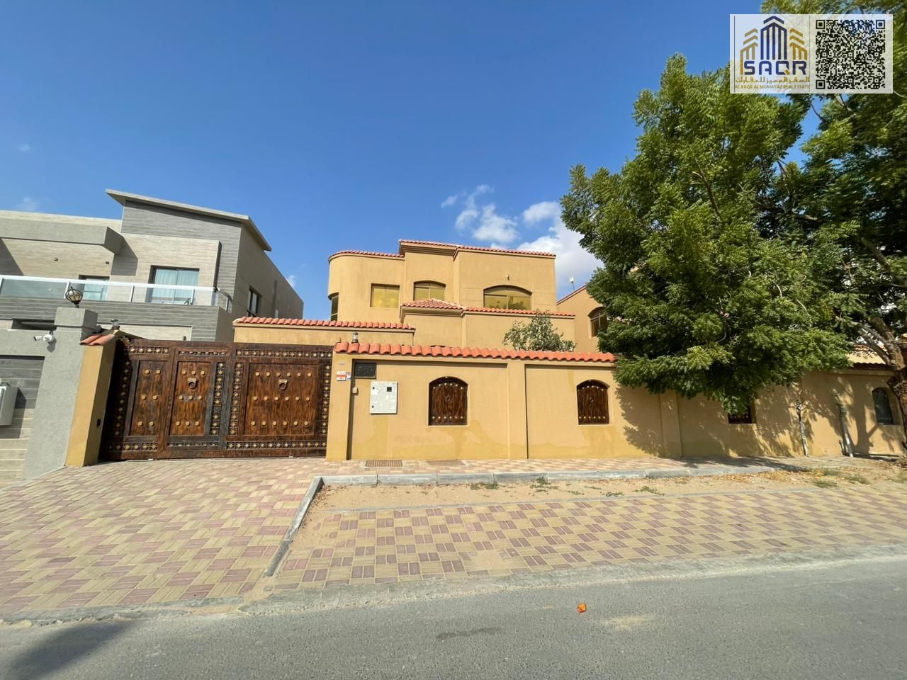 Residential/commercial villa in Al Rawda, located on the main street, available for immediate occupancy. The price includes electricity, water, and ai