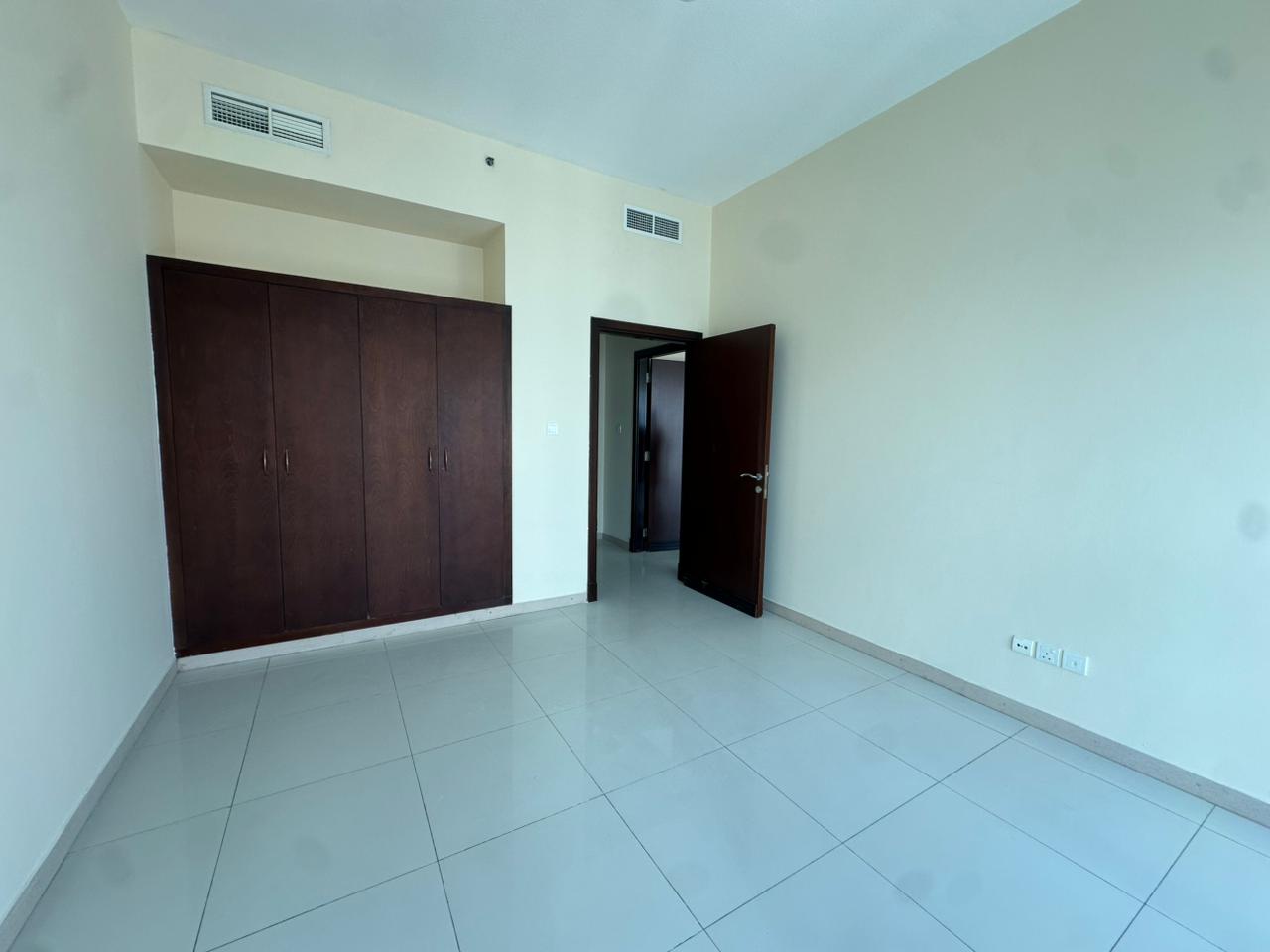 Two bedroom apartment with living room in Al Khan, free AC and parking, master bedroom, panoramic lake view, gym and pool, close to Dubai exit.