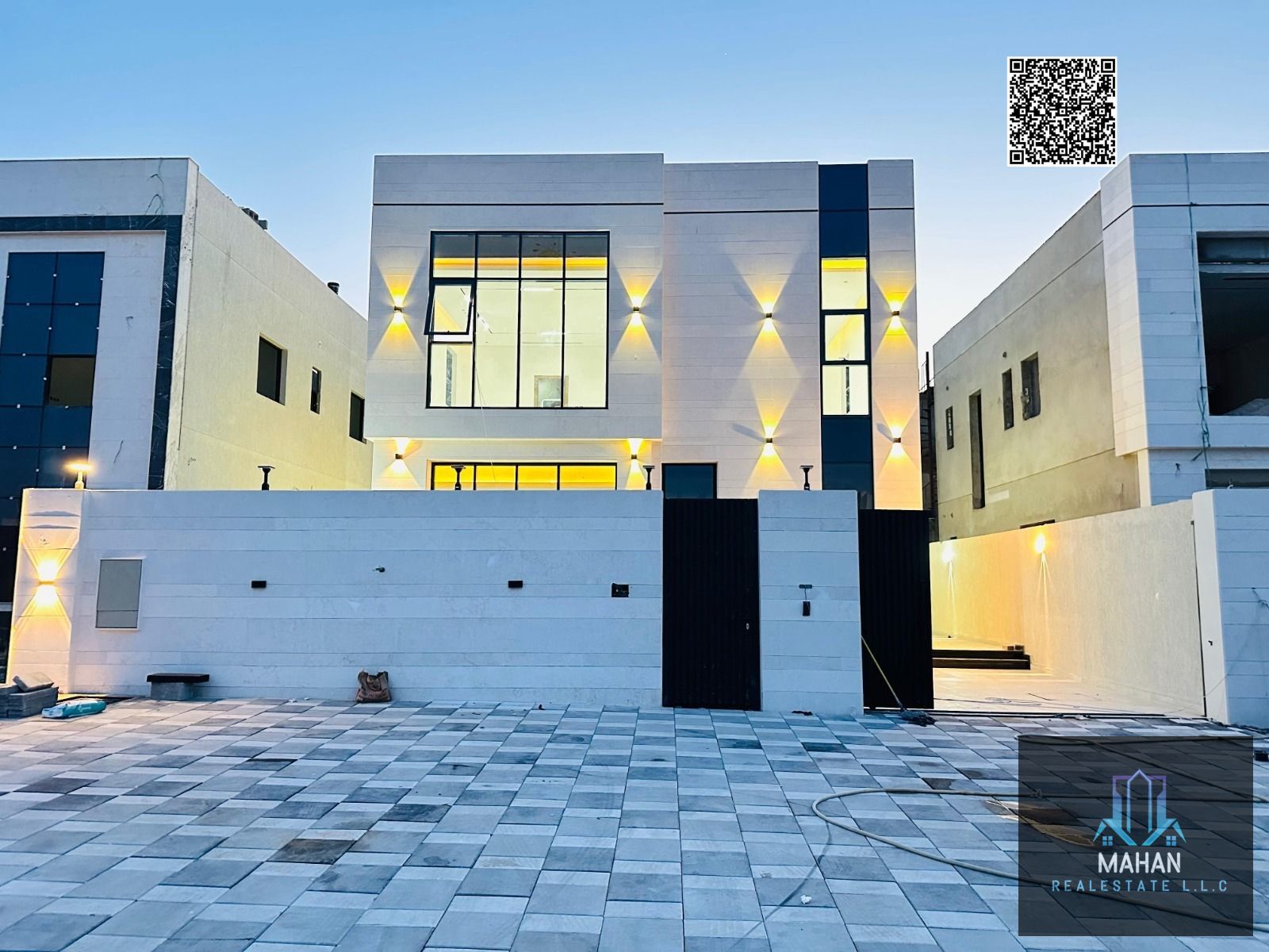 distinctive villa for sale in Al Helio 2, Ajman, featuring a modern design and high-quality finishing. Ideal for family living, with the price inclusive of registration and ownership fees and open to negotiation.