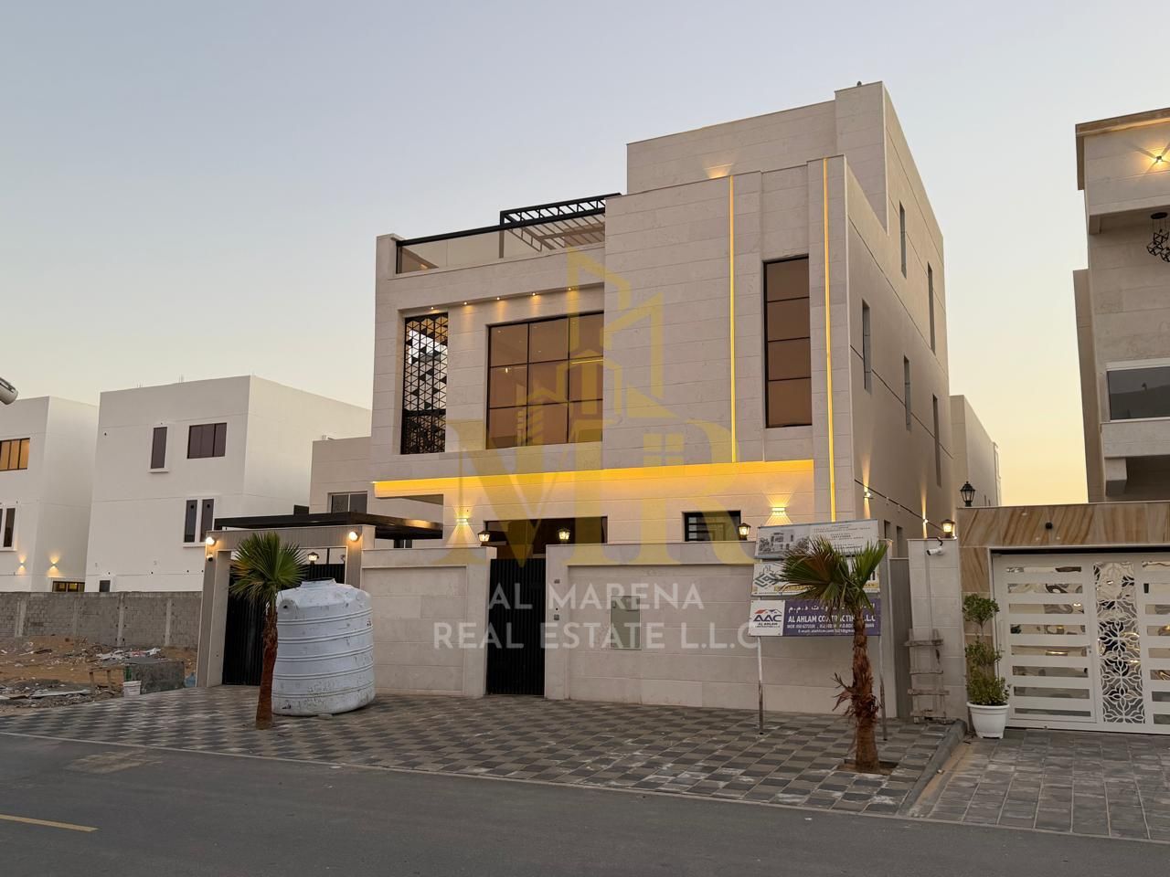 A villa for sale in Al Bahia, Ajman. The price includes registration and ownership fees, and includes air conditioning. Located on a main street, this