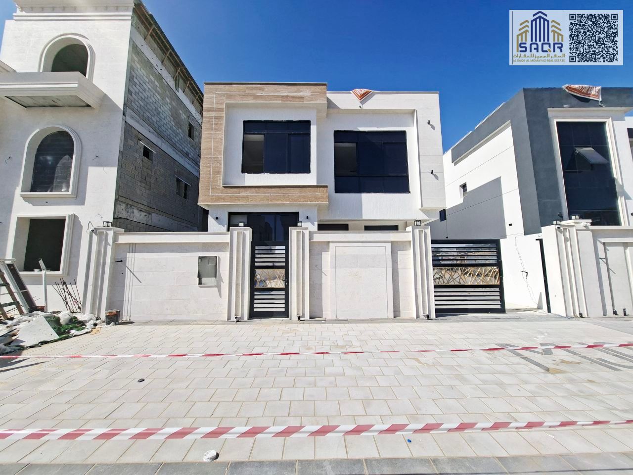 Deluxe villa for sale in Al Helio 2, Ajman. Includes registration and ownership fees. 5 master bedrooms, central air conditioning, freehold ownership
