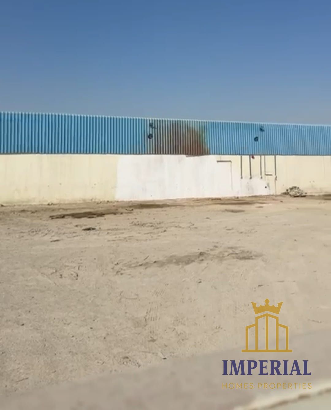A fenced industrial plot (enclosed area) in Umm Al Thu'ub Industrial Area, Umm Al Quwain.
