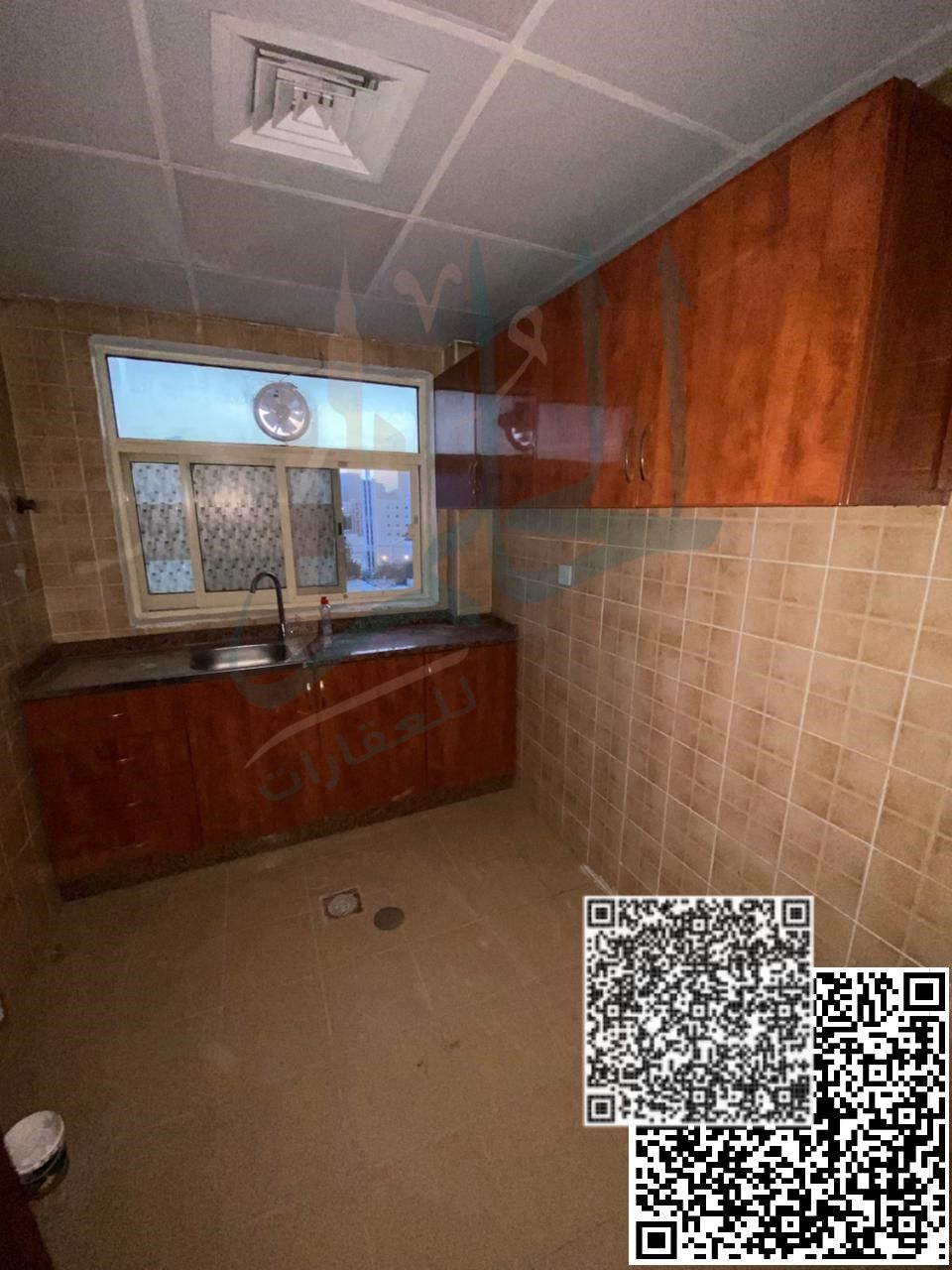 Annual rental opportunity – Two-bedroom apartment with a living room, balcony, good view, two bathrooms, prime location in Al Rashidiya 2