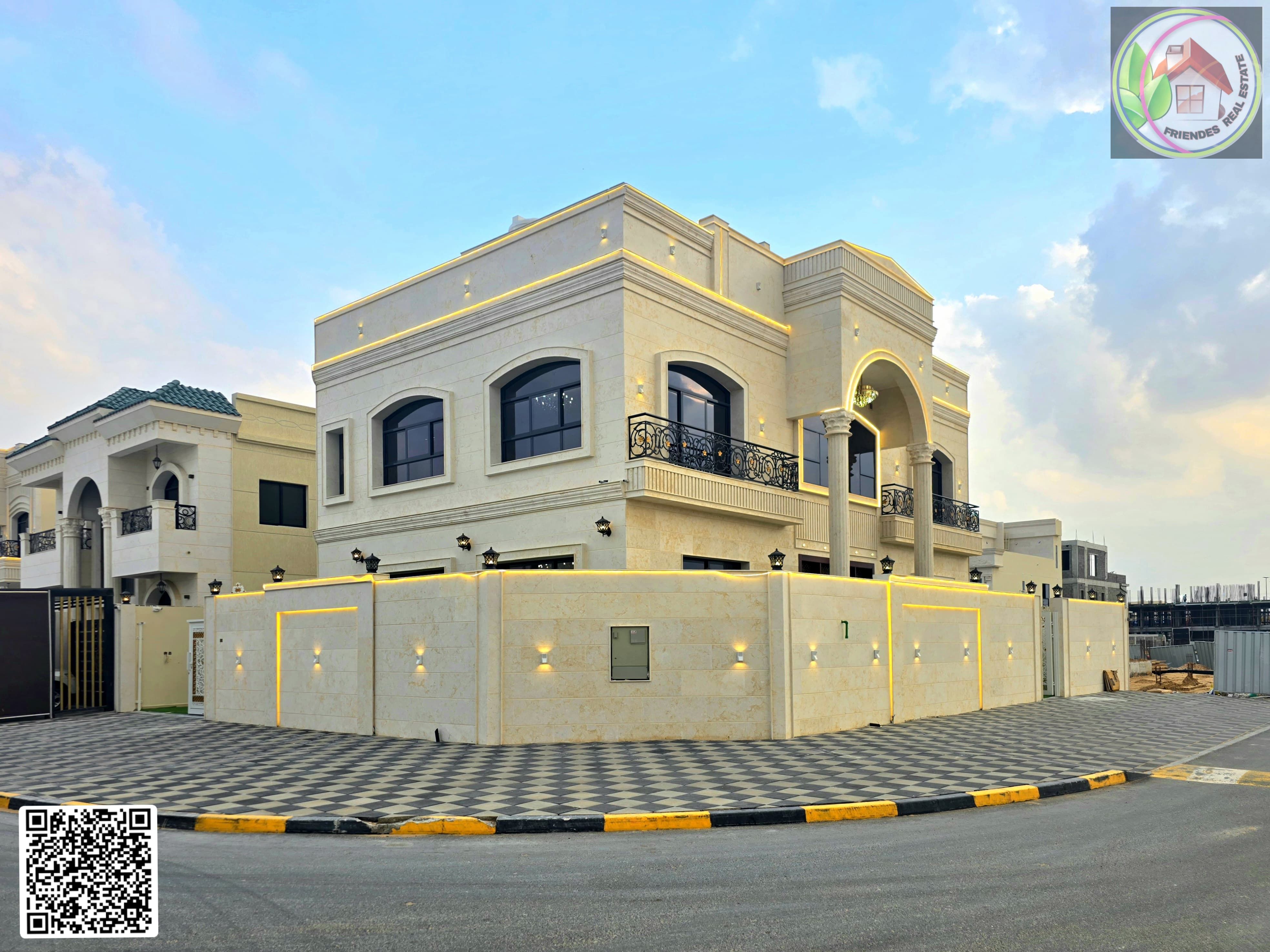 Corner classic villa with a large area and an internal roof opposite Al Hamidiya Park, central air conditioning, freehold ownership for all nationalities.
