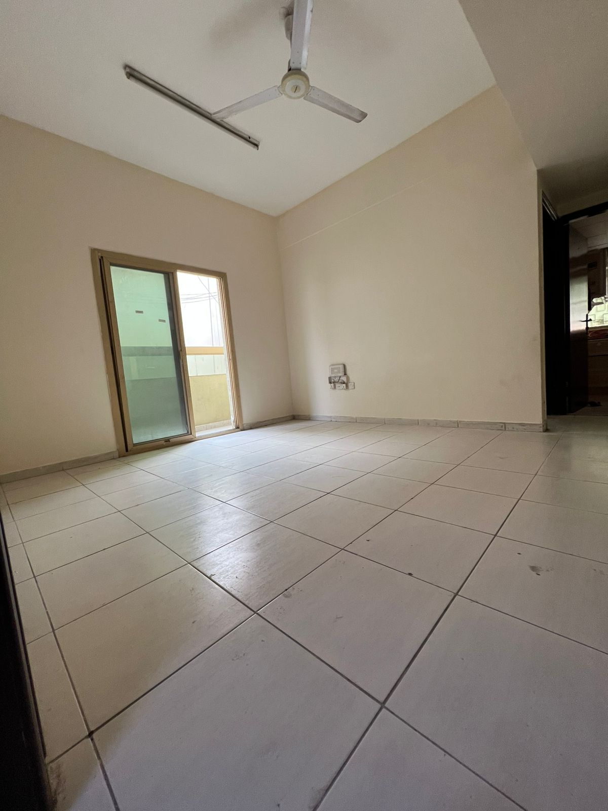 Bedroom and living room in Al Naba’ah, family only, balcony, central AC and gas, rent AED 25,000, 4 cheques.